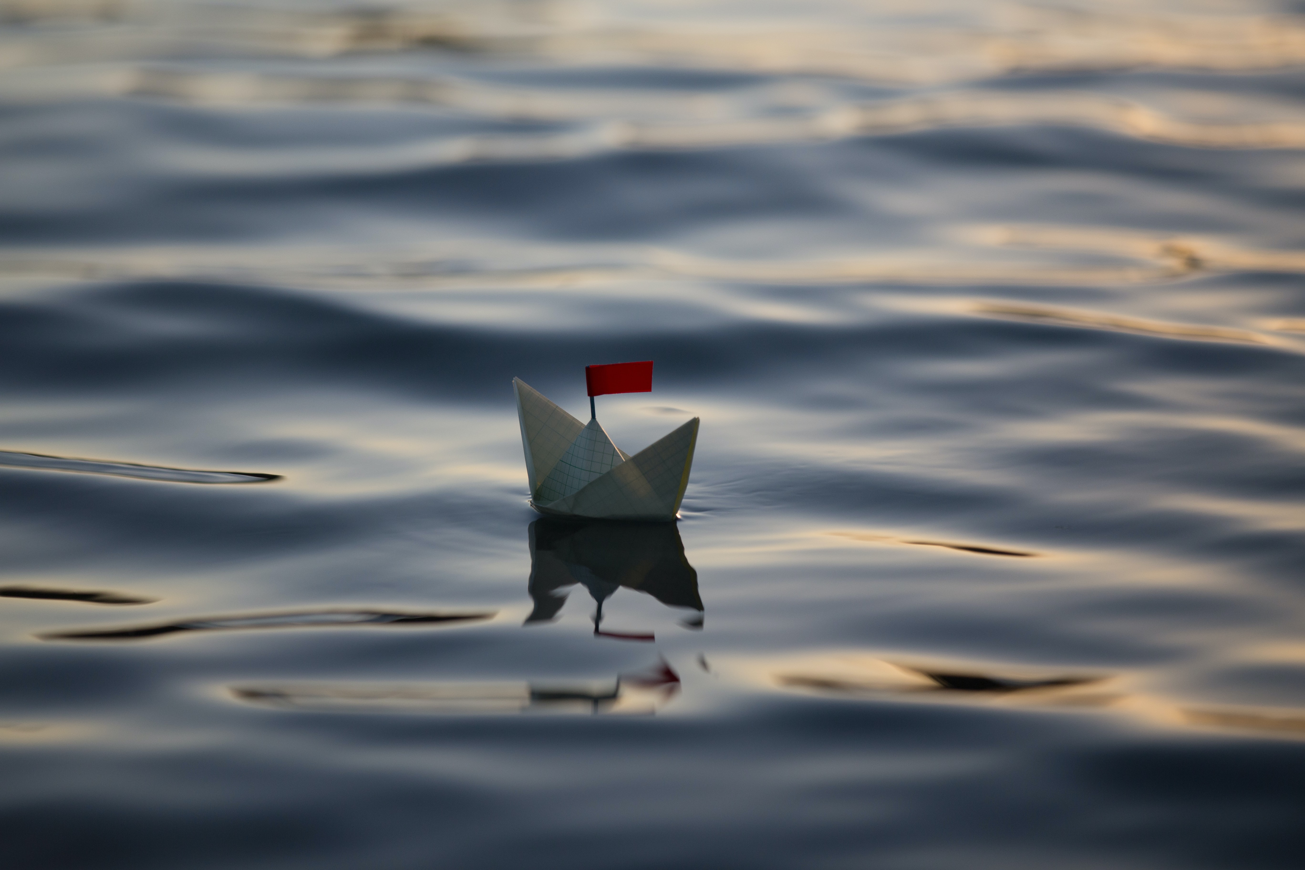 a paper boat on water