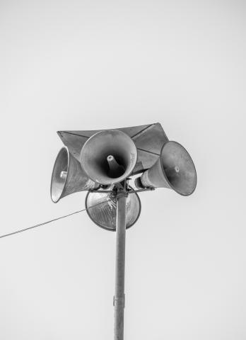 a black and white image of speakers